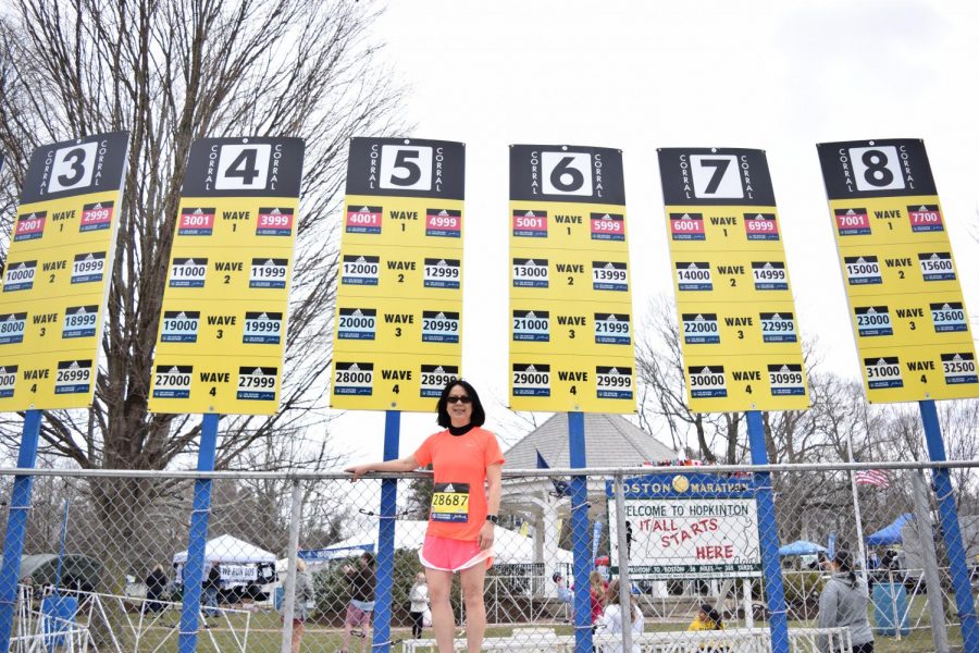 Photo: Denise Antaki standing in front of her corral sign two days before her big run.