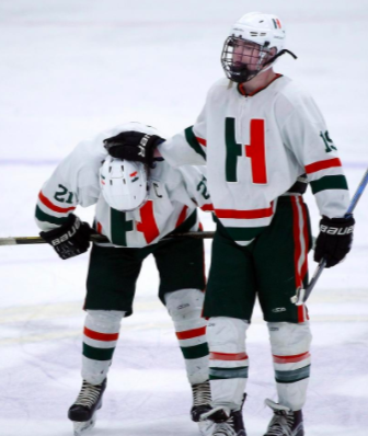Photo: Tommy Hamblet consoling linemate Owen Delaney after State Sectional Semi-final. Photo by Robin Chan