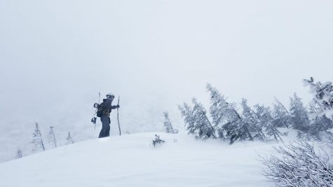Photo: Lu Wang fighting the howling winds as he makes the final push to the summit of this tiny hill off of the trail.