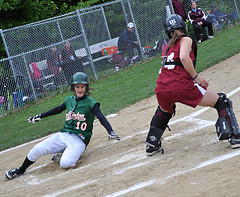 Senior Kelly Sanborn beats the tag sliding home scoring one of the 15 run the girls scored Tuesday May 11 against Millis. Photo by Ryan McLean