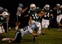 Ryan Bohlin, a Hopkinton Hiller, avoids being tackled by opposing Medfield player during Hopkintons opening home football game  on September 24th, 2010. Photo by Kellie Lodge