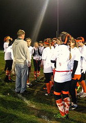 Junior girls strategizing with Coach Franchock during half time at the Powderpuff game. Photo by Caroline Devine.