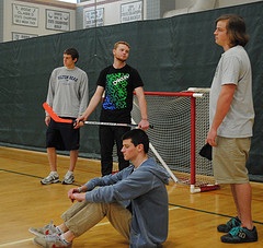 Several High School kids are bored after school, trying to get a pick up game of floor hockey started and wishing intramural sports werent canceled. Photo By Connor Engstrom