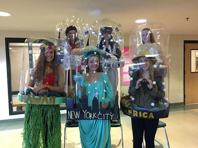 The snow globe group (top row left to right) Anna Bullock, Emily Marculitis, Julia Krapf, (bottom row left to right) Katie Curry, Caroline Coffee, and Rebecca Collins won best DIY costume at HHS senior Halloween. Photo by Veronica Lee. 