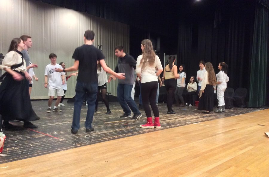 The cast of Spoon River Anthology continuously practices the square dance during tech week to perfect the number. Photo by Josh Normandeau