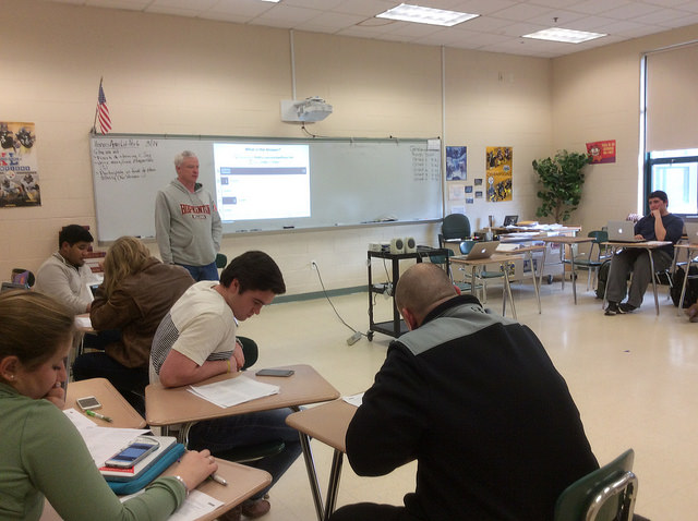 AP Language and Composition teacher, Michael Franchock, reviews a multiple choice activity with his class of 27 juniors. 