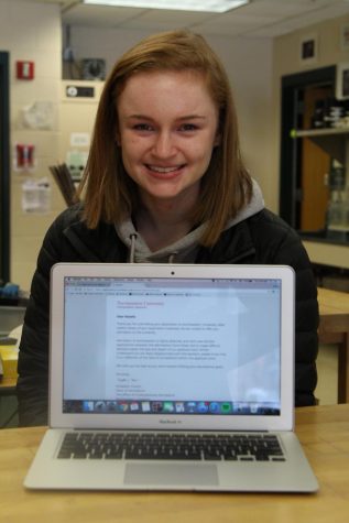 Photo: Senior Natalie White with her rejection letter from Northeastern University.