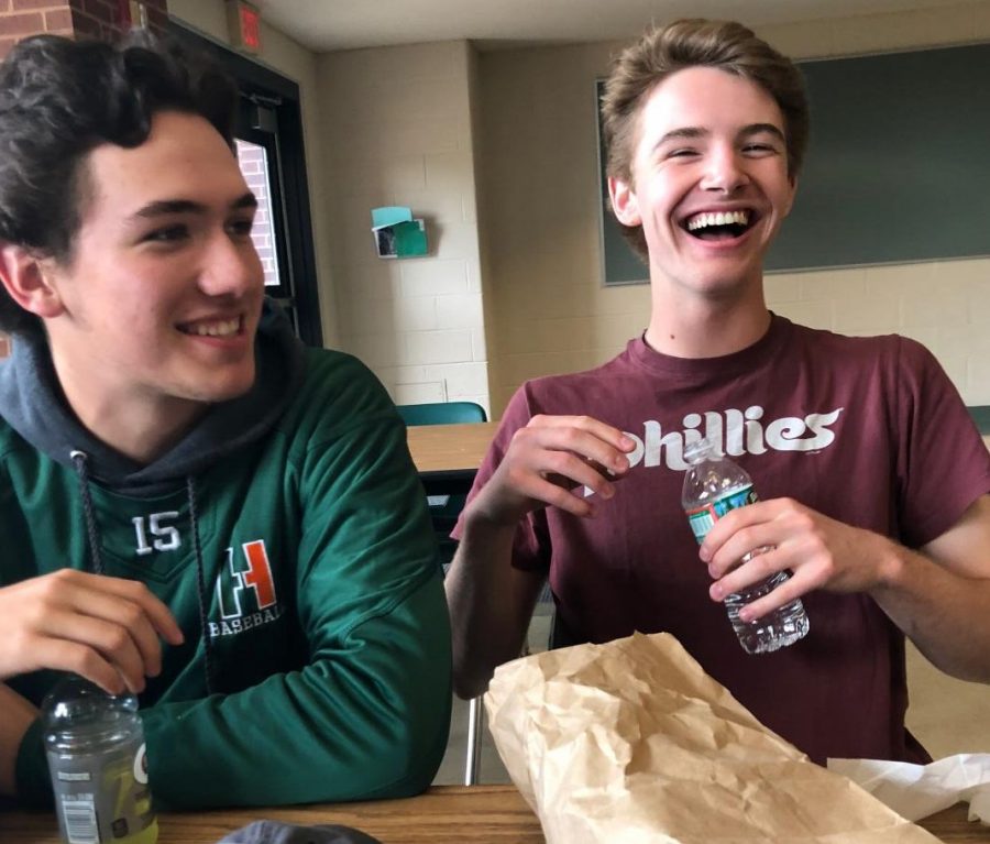 Senior student Tim Burdick laughs at his friends joke during first lunch.  
