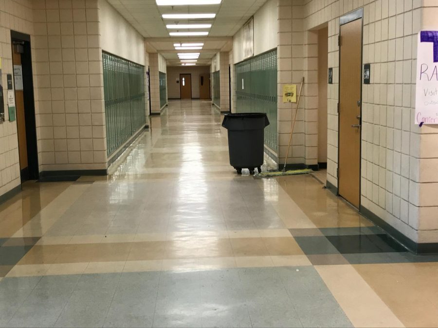 Starkly empty, the hallway remains clear, making this an easier and more convenient time for the janitors to clean.
