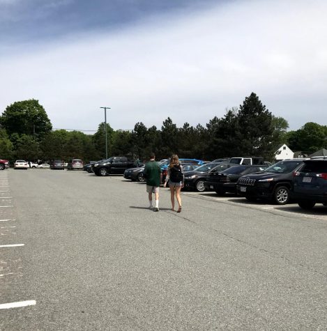 Photo: A senior and a junior locate their cars after school.