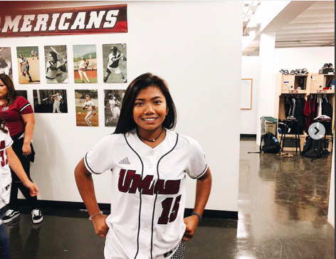 Emily Whelan wearing her new UMass softball jersey at her official visit.