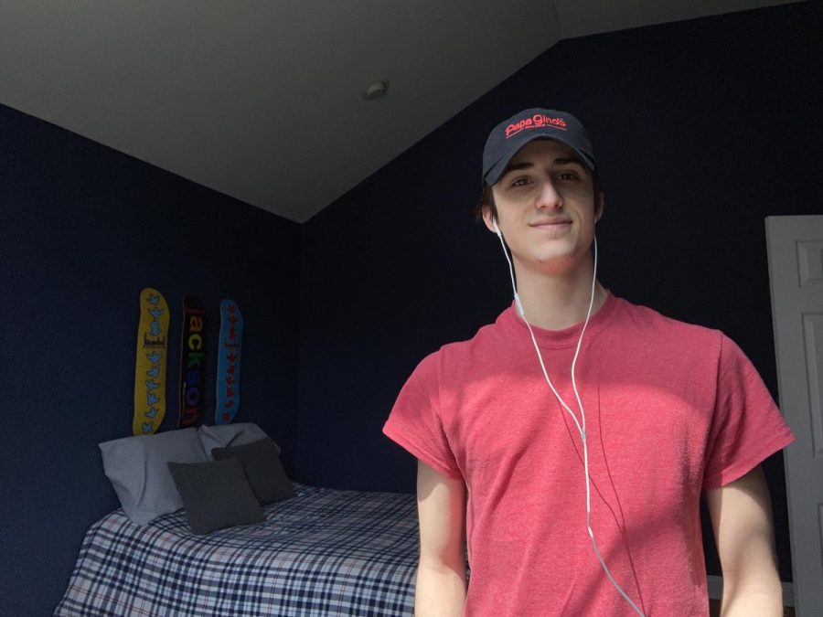 This is a photo of me in my bedroom. My bedroom is where I spend the majority of my time doing homework, watching Netflix, and playing video games. 