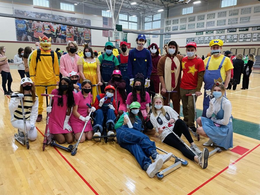 A huge group of seniors put together a fun spin on Mario Kart character with scooters immersive costumes.