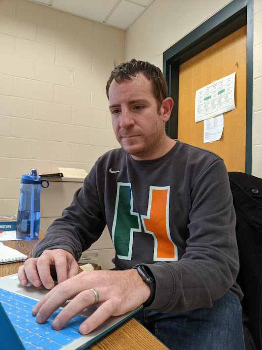 HHS History teacher Steven Spiegel works diligently on his laptop in his classroom on the second floor of the high school.