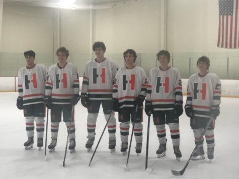 Hopkinton Hockeys eight seniors for the upcoming 2021-2022 season posing for a picture. 