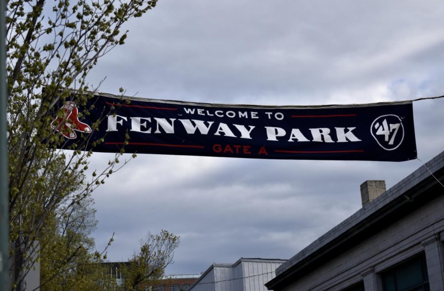 Photo of Fenway banner waving in a blue cloudy sky