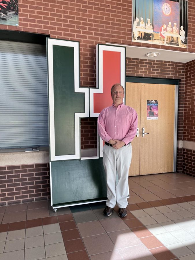 Band Teacher and Director Mr. Craig Hay poses in front of the auditorium.