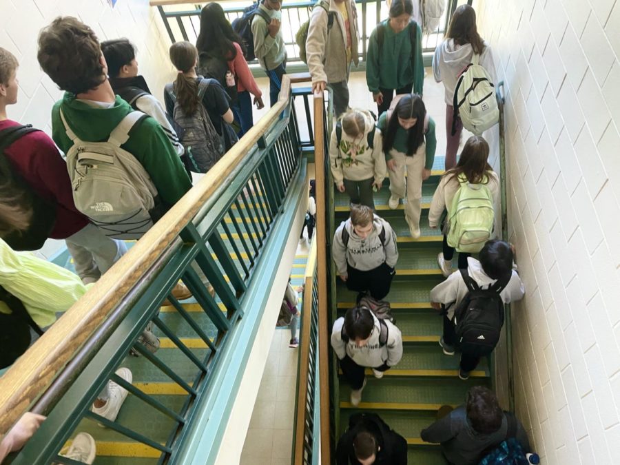 Photo: Students walking up the crowded stairwell