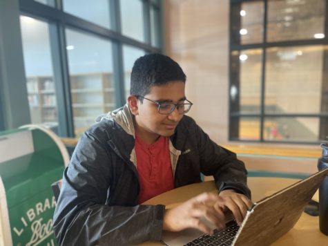 Senior Bharat Mekala responding to an email outside the library. Mekala is the vice president for the class of 2023. “I seize the moment and capitalize on whatever opportunities life gives me,” he said.