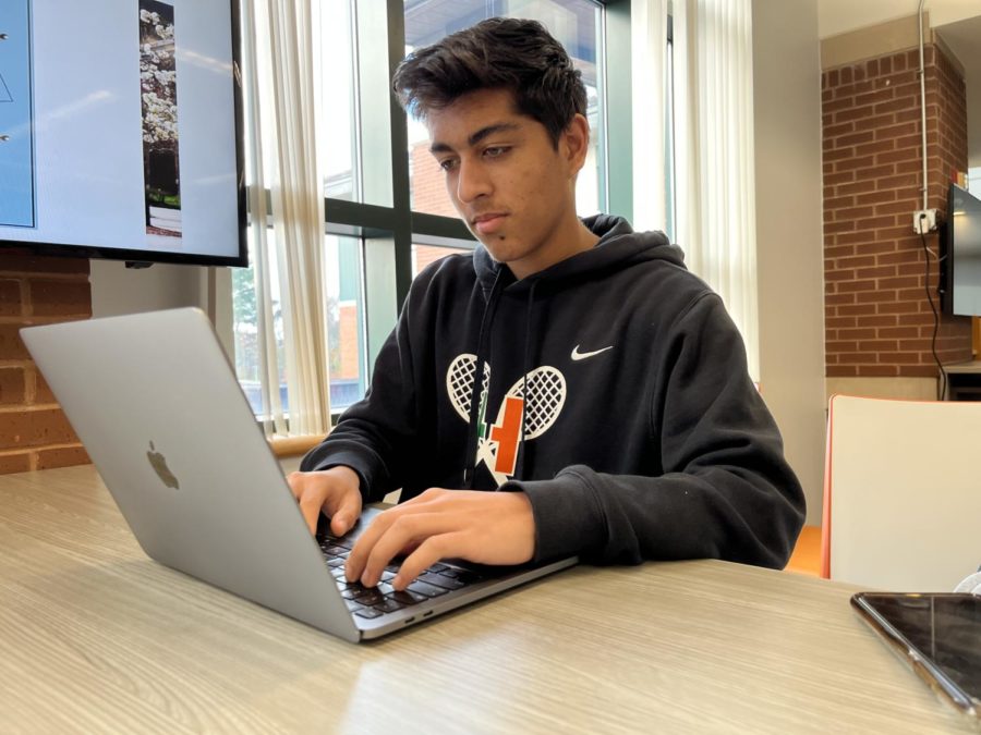 Senior Pranav Kapur racing to finish his supplemental essays during his study in the library at school.