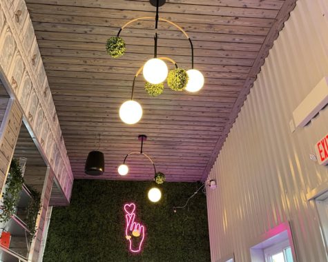 The lighting fixtures and neon signs adorning the walls and ceiling of Jaho are super trendy.