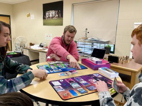 Mr. Challinor (advisor) and students playing games during board game club