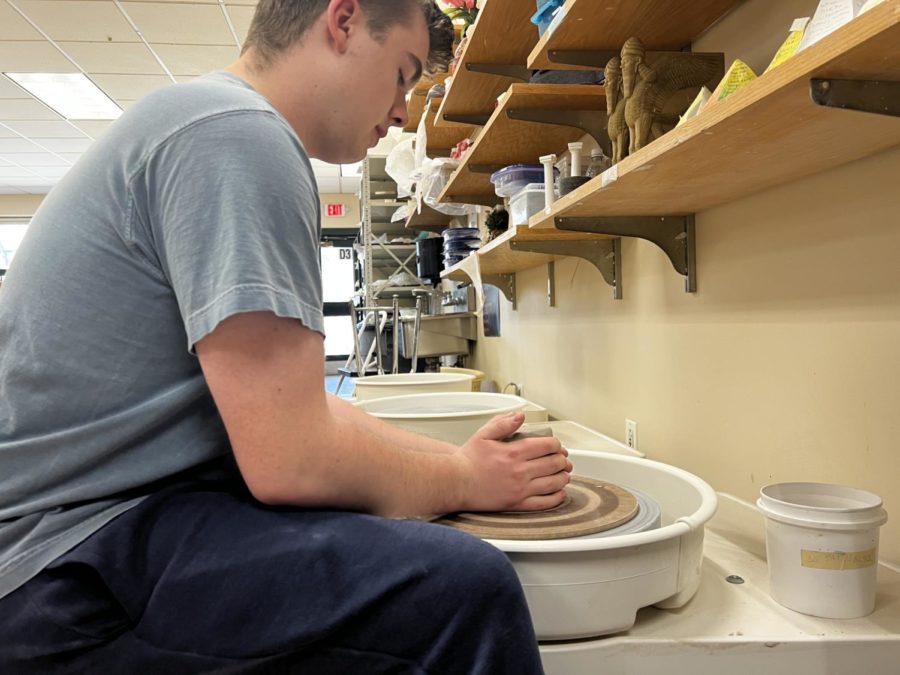 Spinning into artwork. A member of the clay club throwing clay on a pottery wheel. The wheel is one of the many ways clay club members create their work. We’ve had as many as 40 kids [attending clay club], said Christine Enos.  