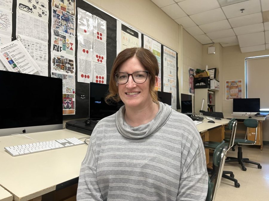 Ms. Fournier, Computer Science teacher sitting in the Web Design classroom at HHS.