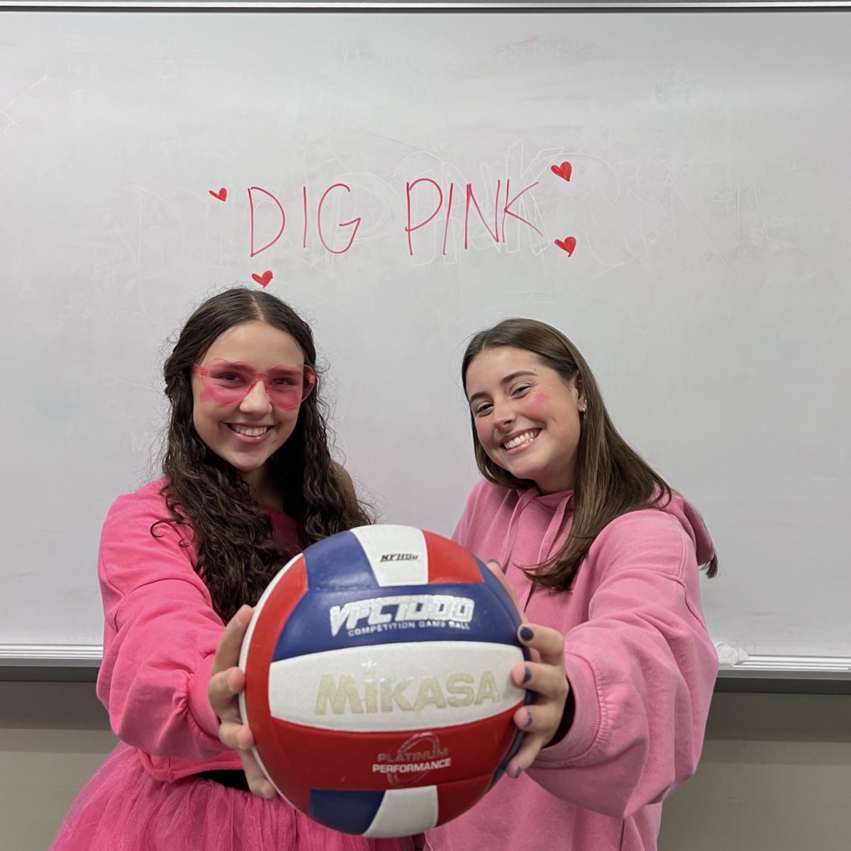 In+honor+of+Dig-Pink%2C+players+Maddie+Fitzpatrick+and+Gabby+Pattie+dressed+in+pink+before+the+game.+