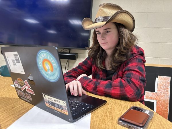 Rylee Blair sits in front of her laptop as she works on code for the robotics program.