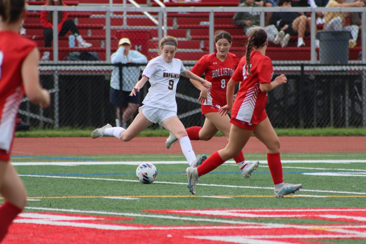 Sophomore midfielder Mairin O’Connor winds up for a shot against Hopkinton’s perennial rival Holliston.