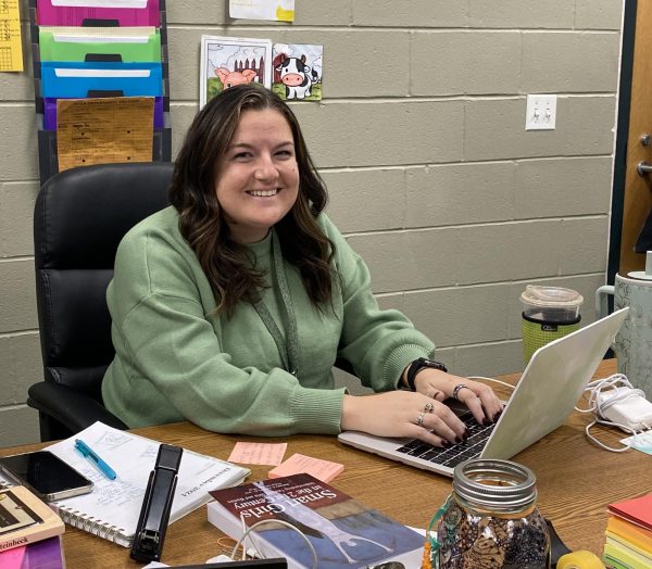 Jessie Karner sits at her desk and checks her email during lunch block. She will finish her day in the classroom, then head to coach varsity wrestling after school. 